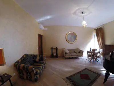 a living room with a couch and a table at Pantheon Old Suite in Rome