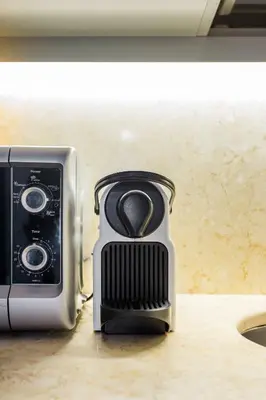 a toaster oven sitting on top of a counter at Andreasuite Trastevere in Rome