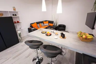 a kitchen with a table and chairs with fruit on it at The Apartment Trastevere - Ba.home in Rome