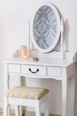 a white dressing table with a mirror and a stool at Saint Peter Cozy Apartment in Rome