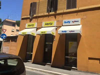 a building with a help sign on the front of it at Saint Peter Cozy Apartment in Rome