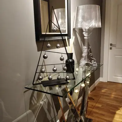 a glass table with a christmas tree on it at K Rooms in Rome