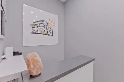 a room with a bench and a picture on the wall at New Rome house 2 in Rome