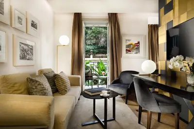 a living room with a couch and a table at Margutta 19 - Small Luxury Hotels of the World in Rome