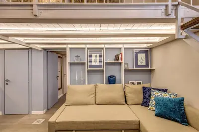 a living room with a couch in a room at Domus Urbana in Rome