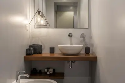 a bedroom with a bed and a bathroom with a tub at EVE Penthouse Colosseo in Rome