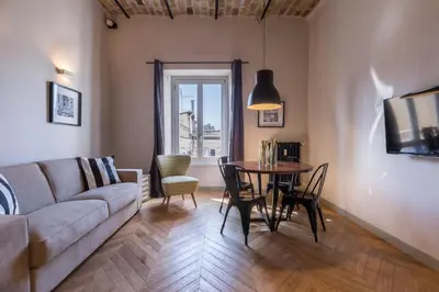 a bedroom with glass walls and a bed in a room at EVE Penthouse Colosseo in Rome
