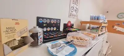 a counter with some food on a table at Bed&BikeRome ROOMS in Rome