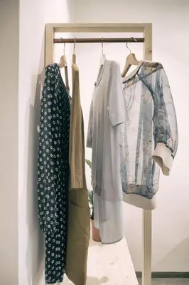 a group of clothes hanging on a rack at Santa Nara B&B in Rome
