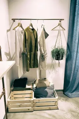 a room with three wooden drawers and clothes at Santa Nara B&B in Rome