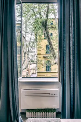 a window with a air conditioner in front at Santa Nara B&B in Rome