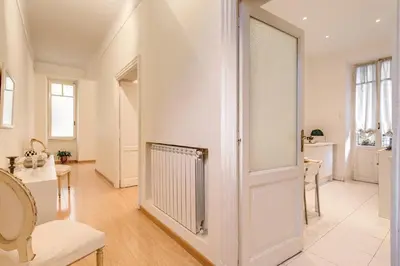 a living room with a door and a table at RHH Rome Holiday Home in Rome