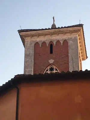 a tall brick building with a bell tower at RHH Rome Holiday Home in Rome