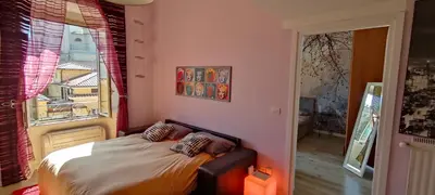 a bedroom with a bed in front of a window at Valentina Vatican Apartment in Rome