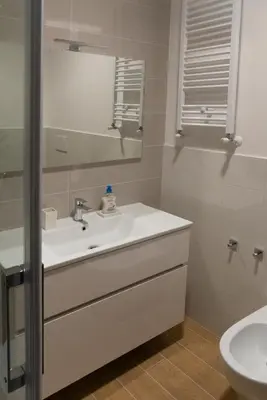 a bathroom with a sink and a mirror at Flaminio New Apartment in Rome