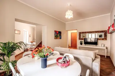 a living room with two tables and a couch at Appartamenti - Via del Monte della Farina in Rome