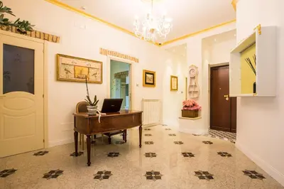 a room with a desk with a laptop on it at Trastevere Royal Suite in Rome