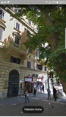 a group of people walking in front of a building at Fabiola's Home in Rome