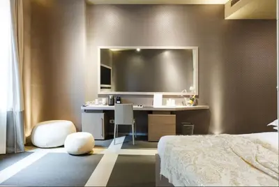 a hotel room with a bed and a television at Private Luxury Suites in Rome