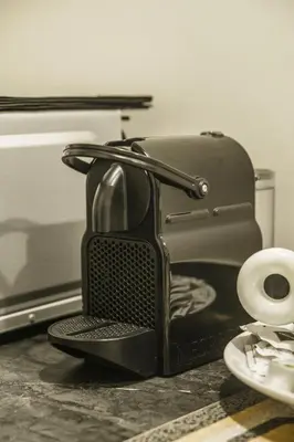a toaster sitting on a table next to a toilet at Residenza Roma Imperiale in Rome