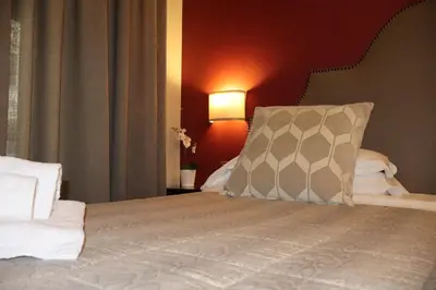 a bedroom with a bed with a pillow on it at Residenza Roma Imperiale in Rome