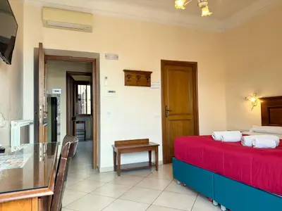 a room with a bed and a table in a room at Anthony House, Anthony Floor 3, Castro Pretorio in Rome