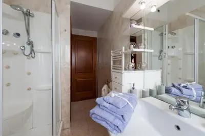 a bathroom with a sink and a shower and a mirror at Residenza il Parco 3 in Rome