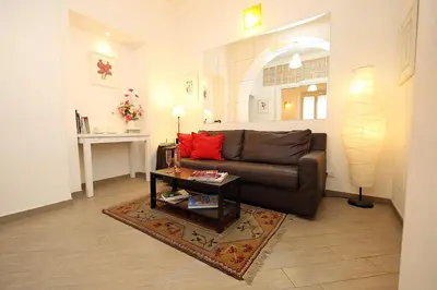 a living room with a couch and a coffee table at Great Central Apartment in Rome