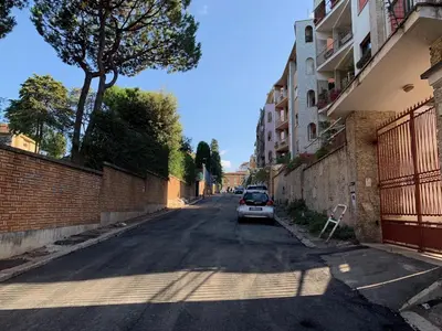 a car parked on the side of a street at Albornoz 35 in Rome