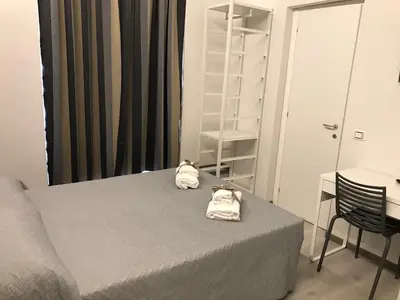 a bedroom with a bed with towels on it at Sangiò Guest House in Rome
