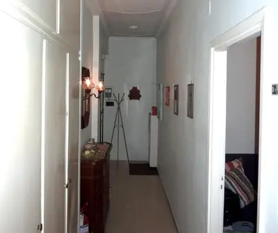 a hallway with a long hallway with at Tommy Guest House Roma in Rome