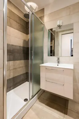 a bathroom with a shower and a sink at Expeditus VATICAN Luxury Suites SAINT PETER'S VIEW in Rome