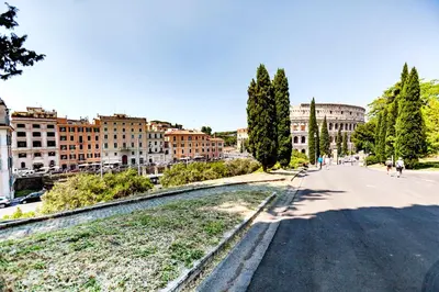 a street in a city with buildings in the background at Stop Colosseo in Rome