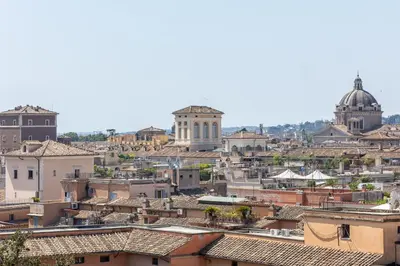 a view of a city with roofs and buildings at Rental in Rome - Fontana Di Trevi Penthouse in Rome