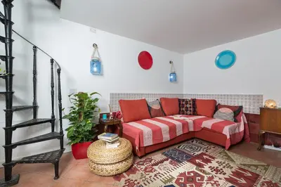 a bedroom with a bed with towels on it at Moroni Trastevere Cozy Apartment in Rome