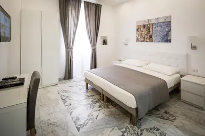 a bedroom with a large bed in a room at Vinci House in Rome