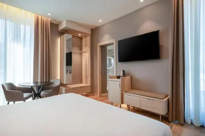 a hotel room with a bed and a tv at AC Hotel by Marriott Clodio Roma in Rome