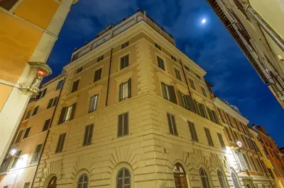 a tall building with a moon in the sky at Lf View in Rome