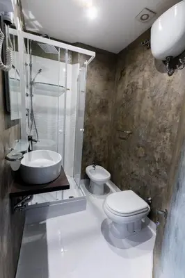 a bathroom with a toilet and a sink and a shower at La Vite Vaticana in Rome