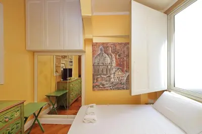 a room with a painting of a building on the wall at Pantheon Luxury Apartment in Rome