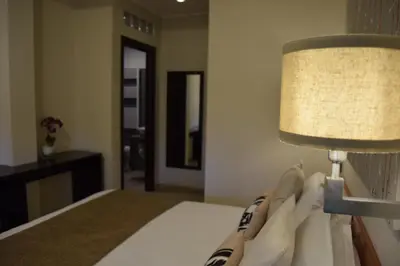 a bedroom with a bed with a lamp on it at Holiday a San Pietro in Rome