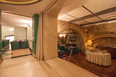 a dining room with a table in a building at Hotel Laurentia in Rome