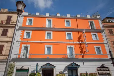 an orange building on the side of a street at Hotel Laurentia in Rome