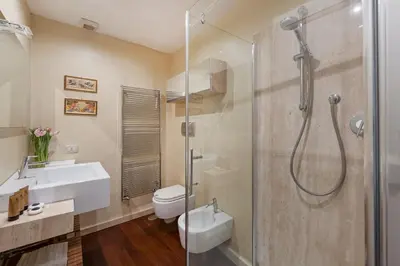 a bathroom with a shower and a sink and a toilet at Antique-Modern Flat by Navona Square in Rome