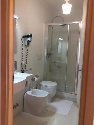 a bathroom with a shower and a toilet and a sink at A Casa Di Penelope in Rome