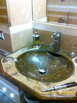 a sink in a bathroom with a counter top at Residenza Al Corso Suites in Rome