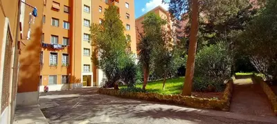 an empty street in front of a building at Casa Dino rooms in Rome
