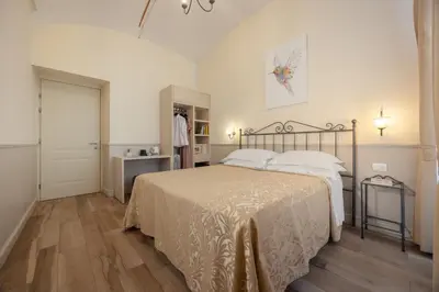 a bedroom with a large bed in a room at Hotel Flavia in Rome