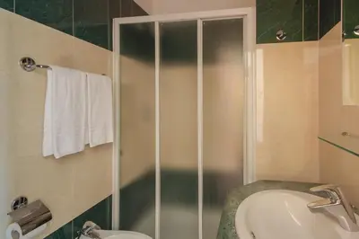 a bathroom with a shower and a sink at Hotel Giorgina in Rome