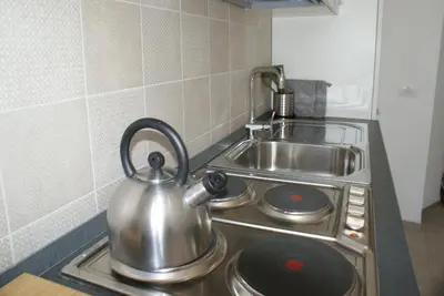 a tea kettle sitting on a stove in a kitchen at St.Peter Accomodation in Rome